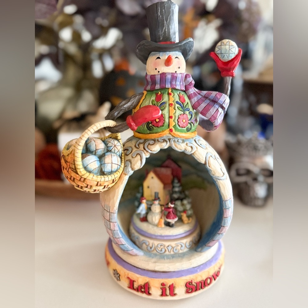 Jim Shore “The Fun Just Snowballs” Colorful Snowman with Village Scene